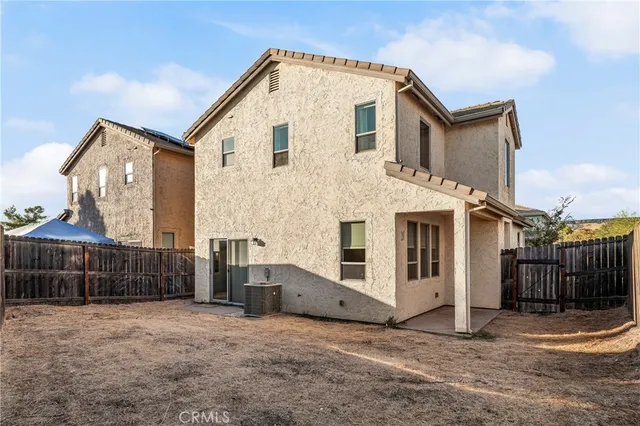 a view of a white house with a outdoor space