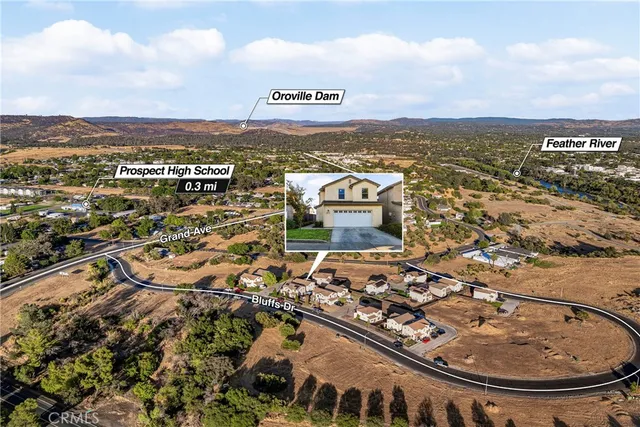 an aerial view of residential building and ocean view