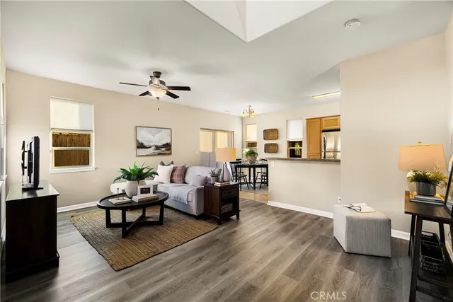 a living room with furniture or couch and a wooden floor