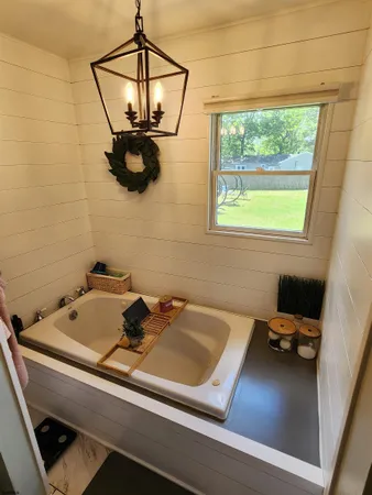 a bathroom with a sink and a large mirror