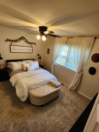 a bedroom with a bed and a walk in closet