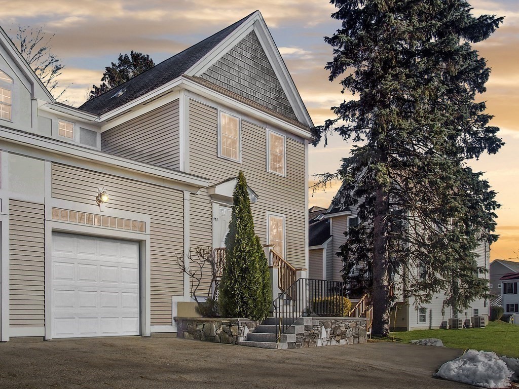 171 North Main Street, Unit 171 Natick, MA 01760 - Photo 15 of 15 a view of a house with a yard and garage