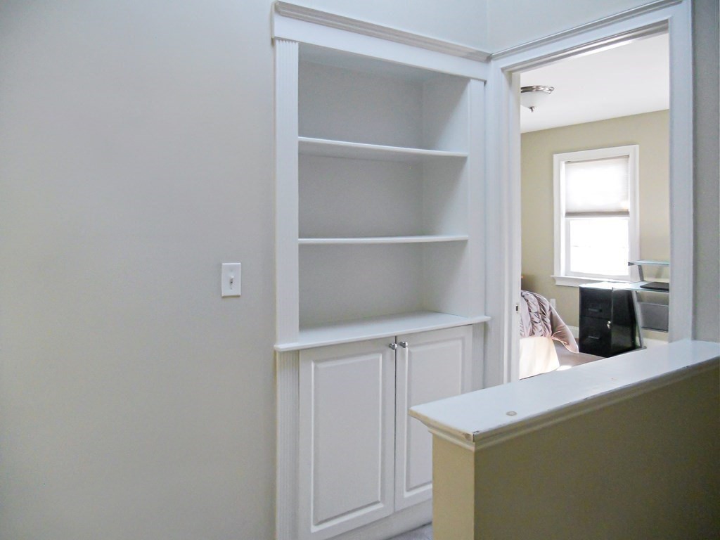 171 North Main Street, Unit 171 Natick, MA 01760 - Photo 9 of 15 a view of cabinets and window