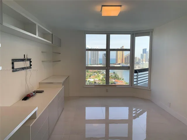 a view of storage and utility room with windows