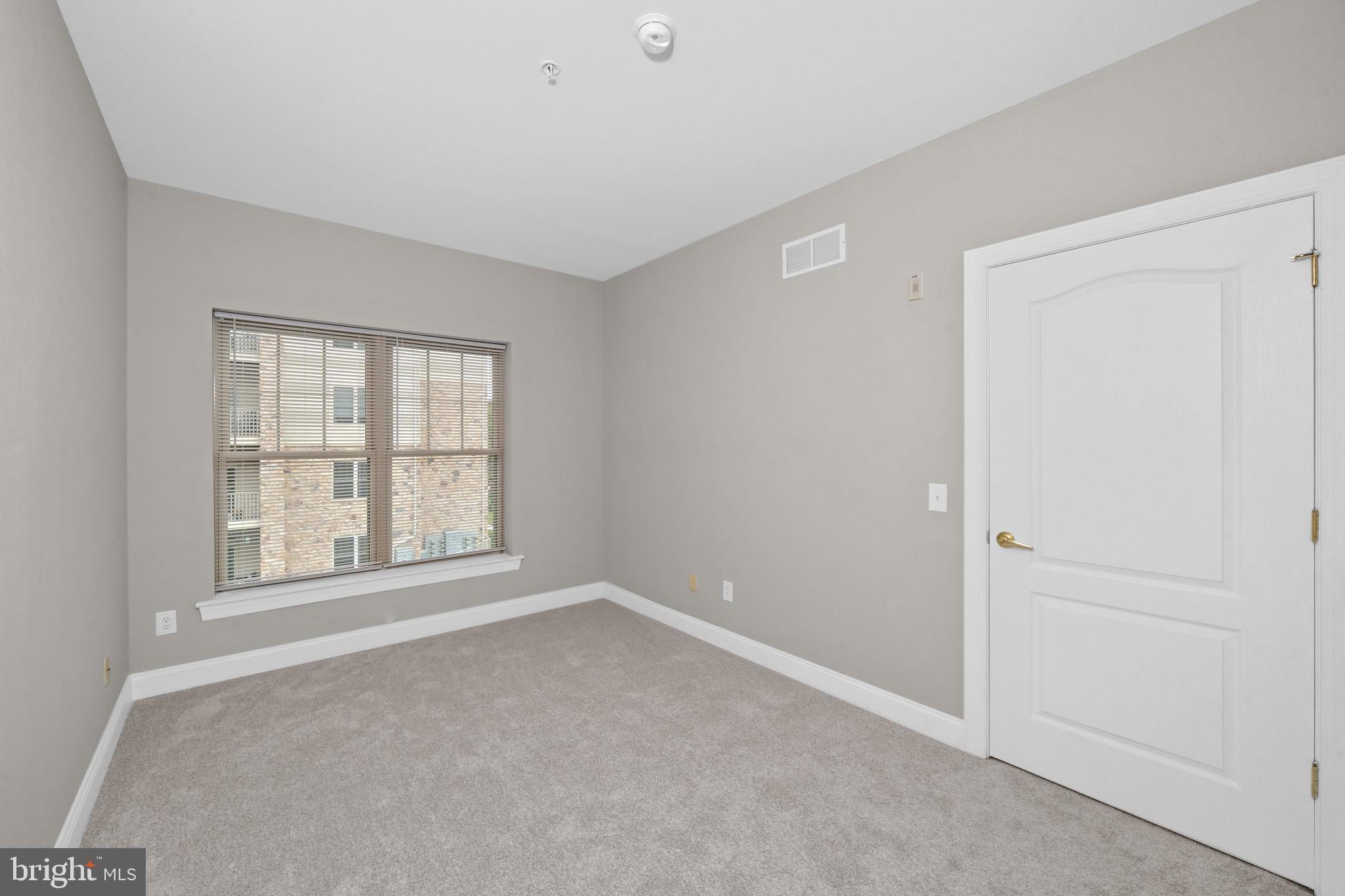 2000 Fountainview Circle, Unit 2312 Newark, DE 19713 - Photo 13 of 15 an empty room with a window