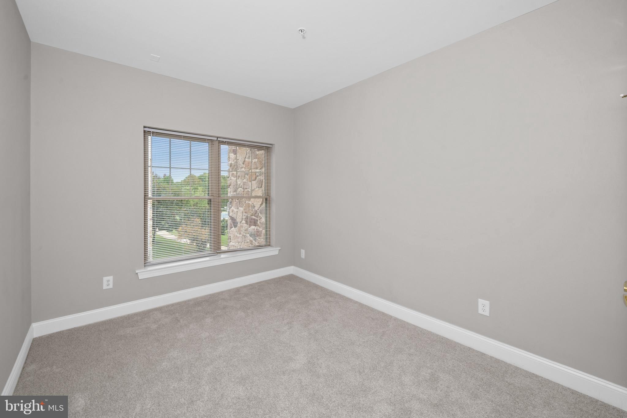 2000 Fountainview Circle, Unit 2312 Newark, DE 19713 - Photo 14 of 15 an empty room with windows