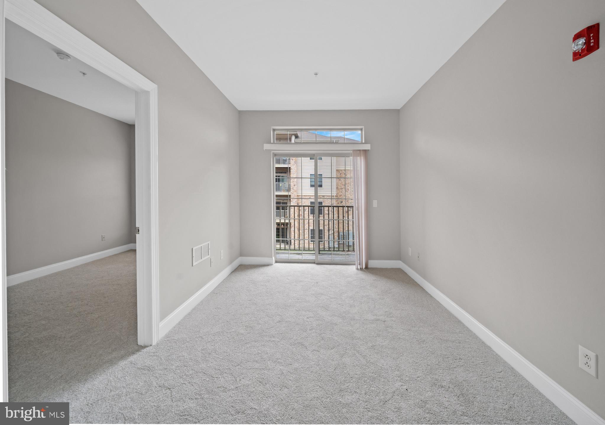 2000 Fountainview Circle, Unit 2312 Newark, DE 19713 - Photo 5 of 15 an empty room with windows