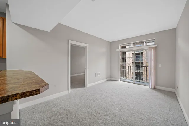 a view of an empty room with a window