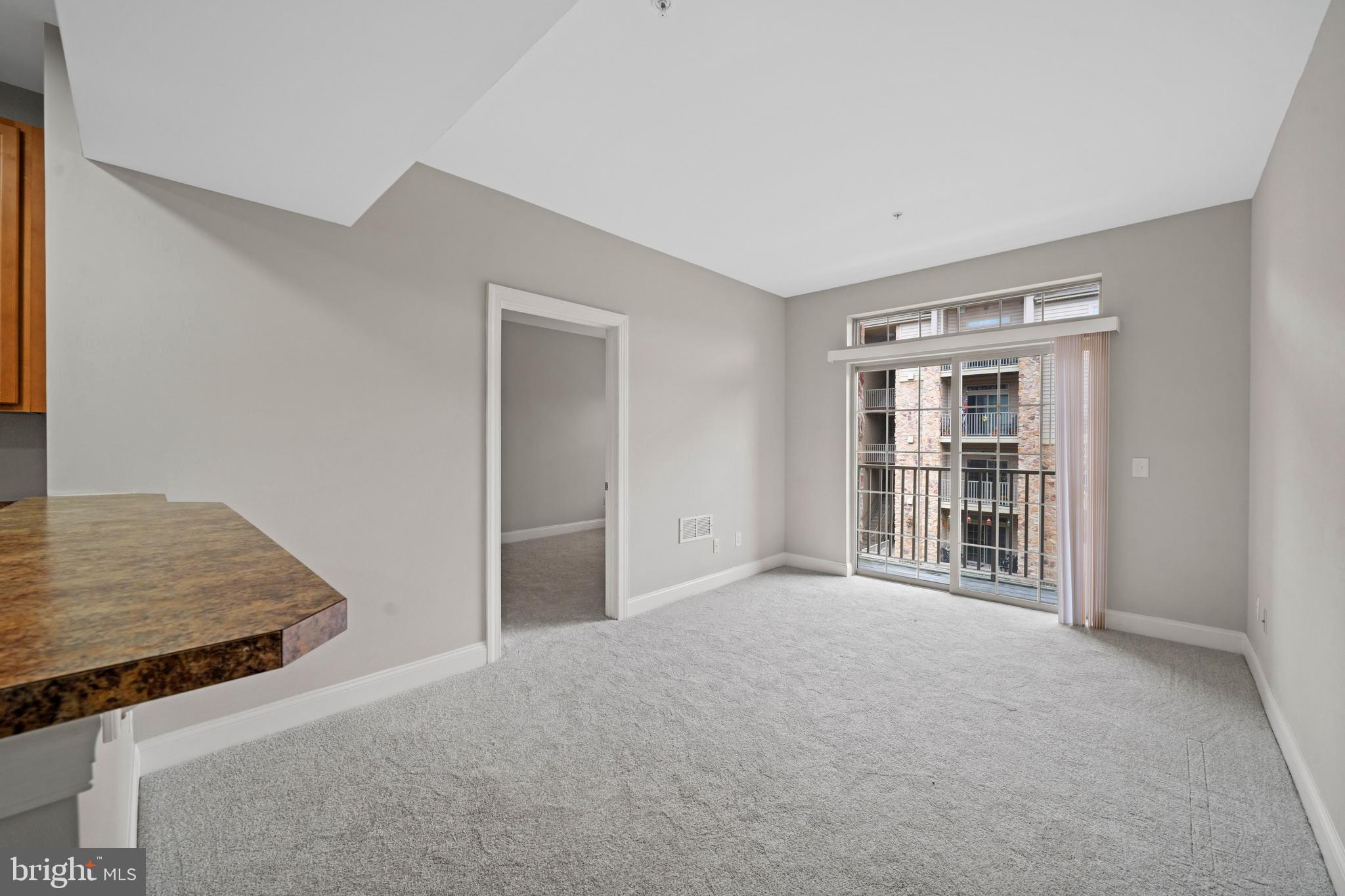 2000 Fountainview Circle, Unit 2312 Newark, DE 19713 - Photo 6 of 15 a view of an empty room with a window