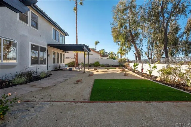 a view of a street with houses on both side