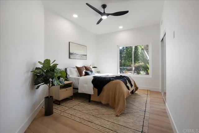 a bedroom with a bed and a couch