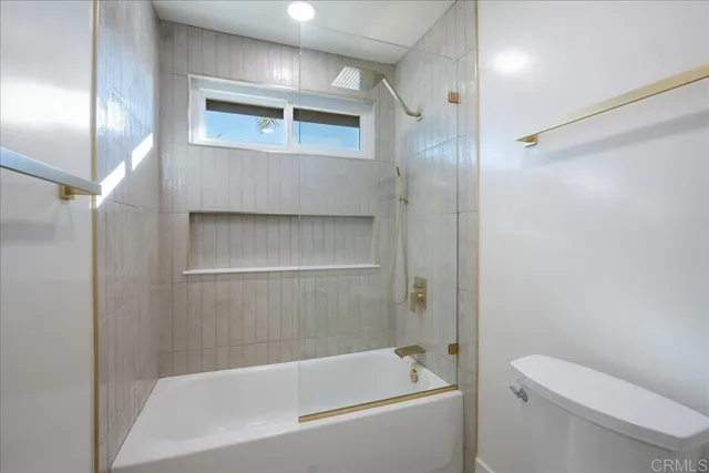 a view of living room and bedroom with furniture