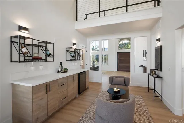 a kitchen with stainless steel appliances kitchen island granite countertop a sink and refrigerator
