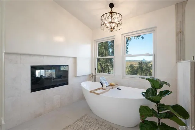 a view of an empty room and a bathroom