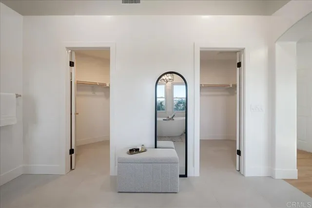 a view of storage and utility room with washer and dryer