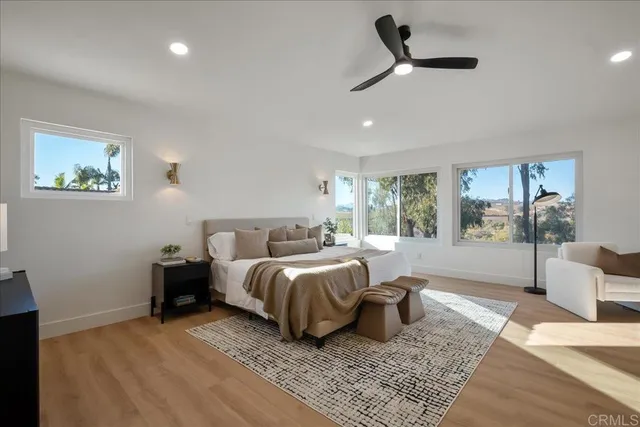 a bed room with a bed a lamp and a rug