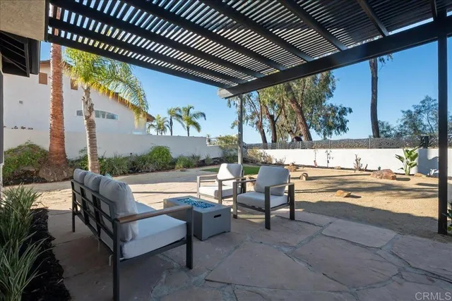 a view of swimming pool with outdoor seating and a couch