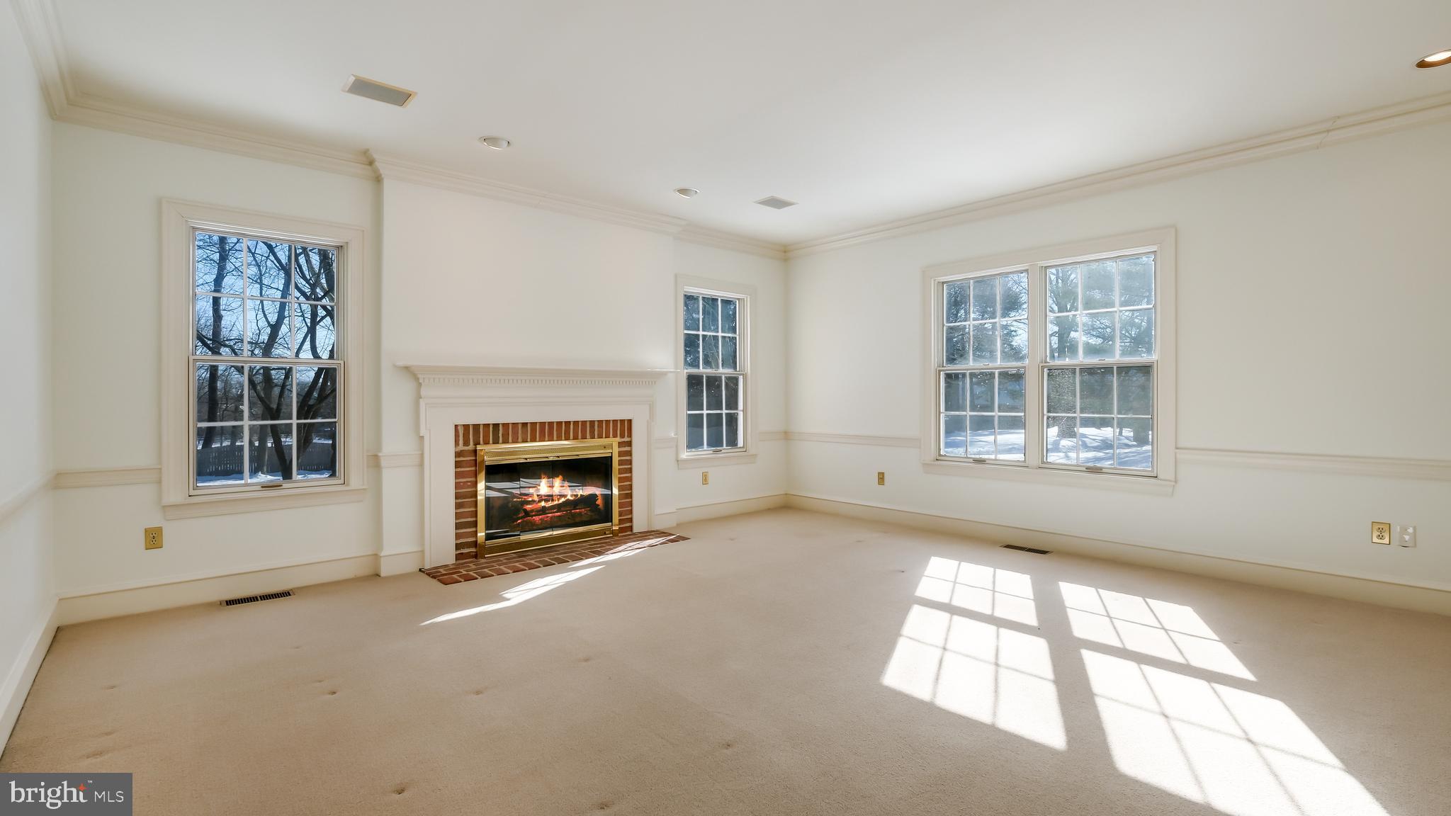 45 Latham Court Doylestown, PA 18901 - Photo 11 of 41 a view of an empty room with a window and fireplace