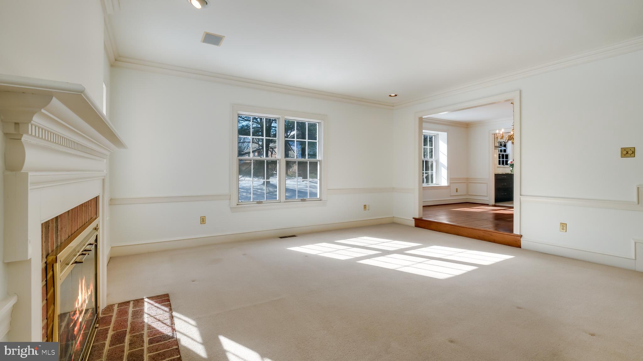 45 Latham Court Doylestown, PA 18901 - Photo 13 of 41 a view of an empty room with a fireplace and a window