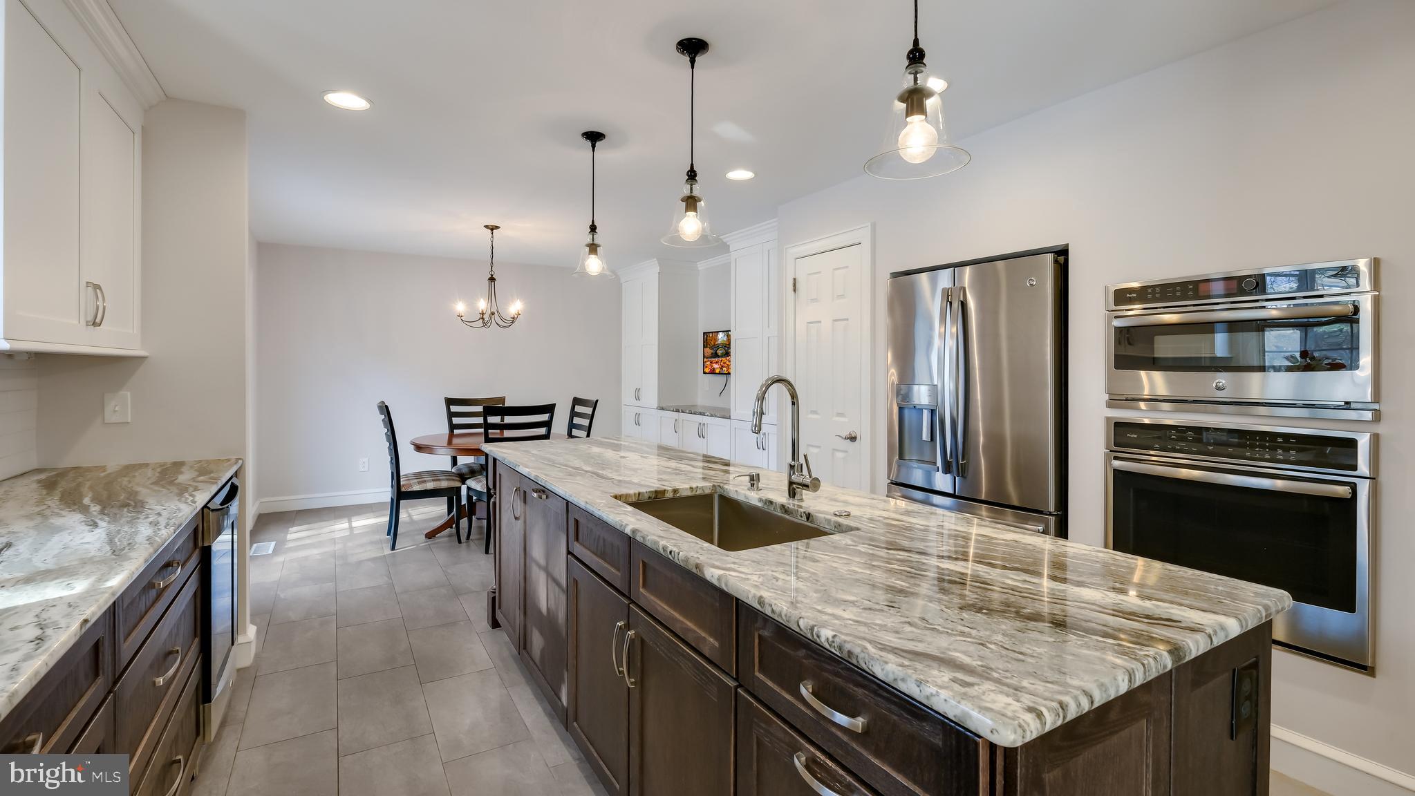45 Latham Court Doylestown, PA 18901 - Photo 15 of 41 a kitchen with granite countertop counter space a sink appliances and cabinets