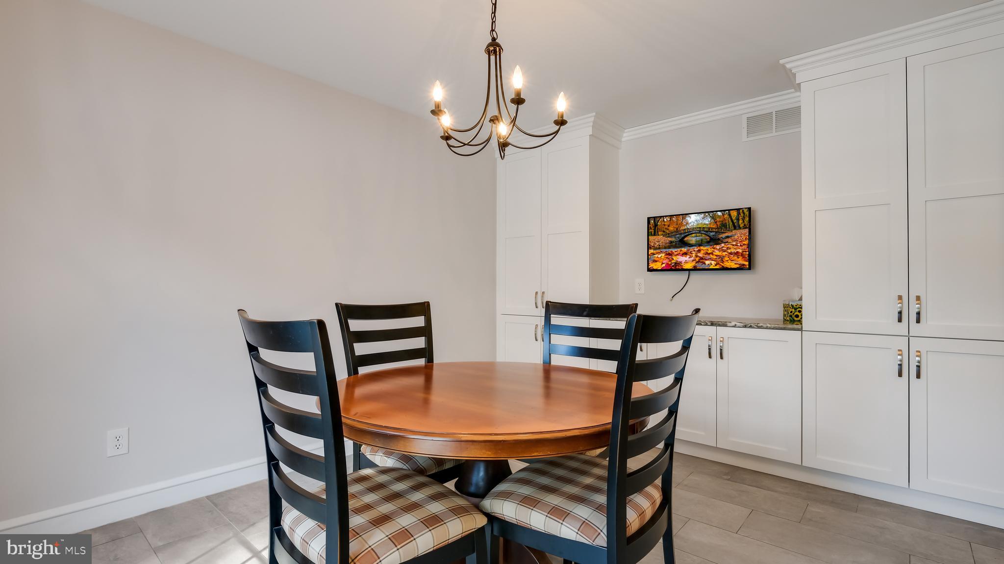 45 Latham Court Doylestown, PA 18901 - Photo 18 of 41 a view of a dining room with furniture and chandelier