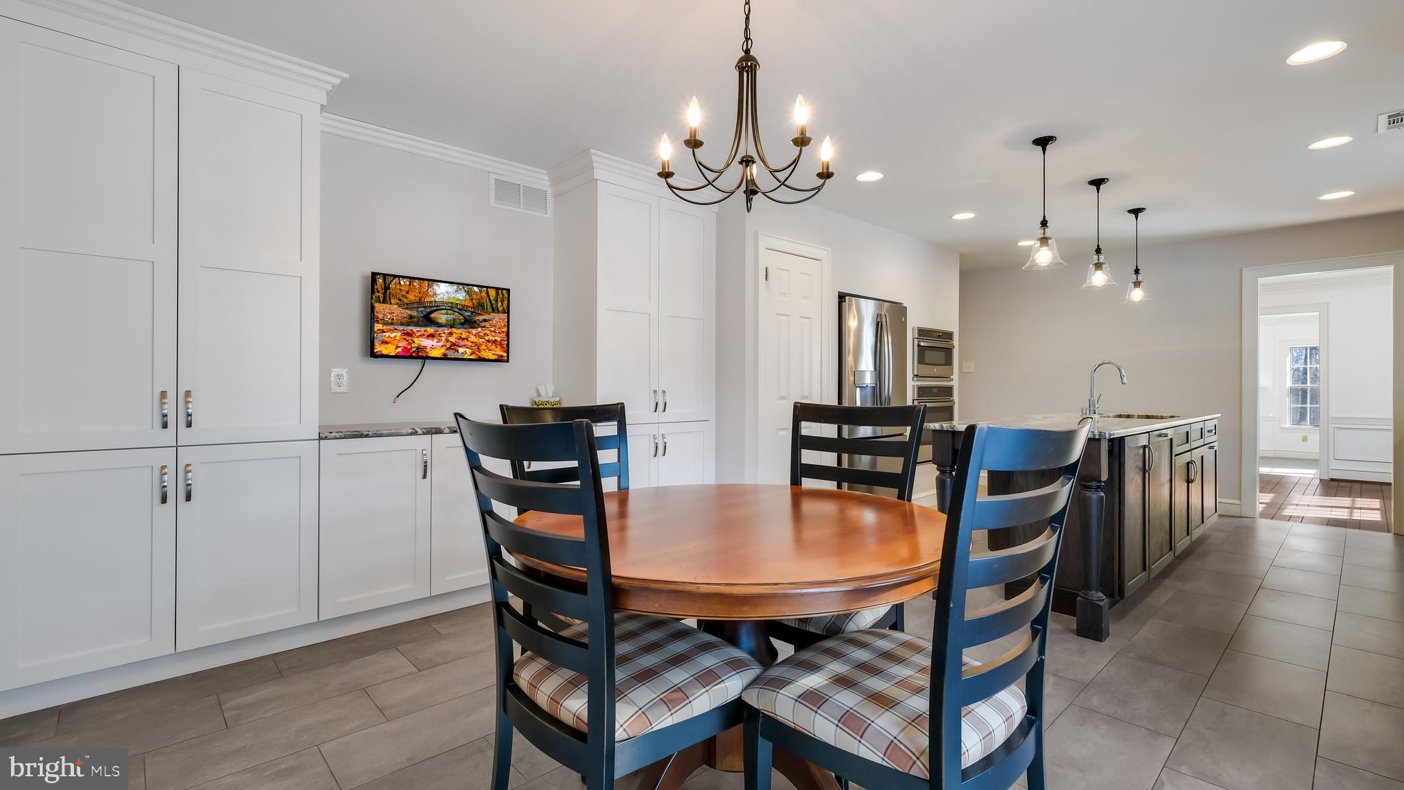 45 Latham Court Doylestown, PA 18901 - Photo 19 of 41 a dining room with furniture and chandelier
