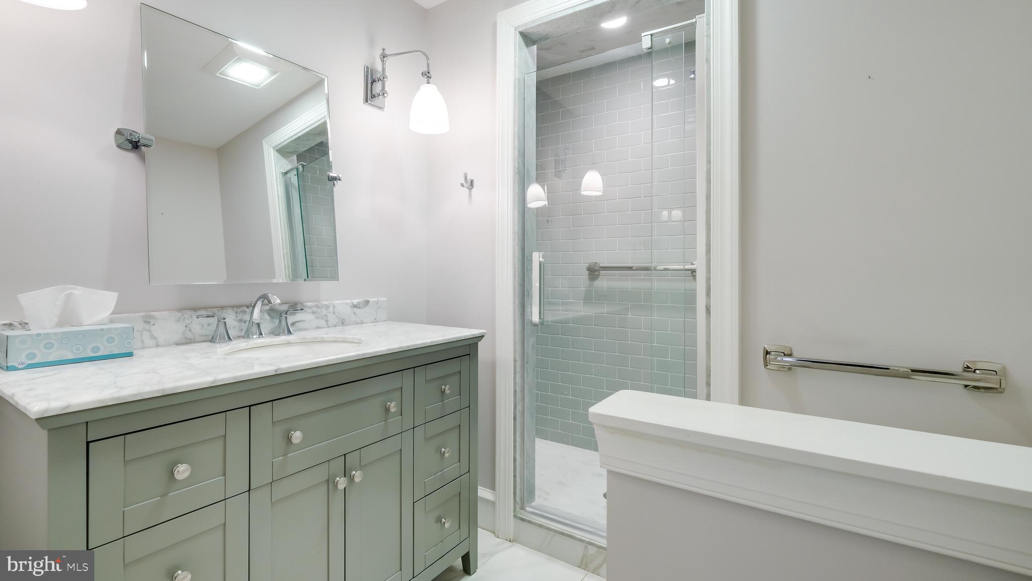 45 Latham Court Doylestown, PA 18901 - Photo 20 of 41 a bathroom with a granite countertop sink a toilet and shower