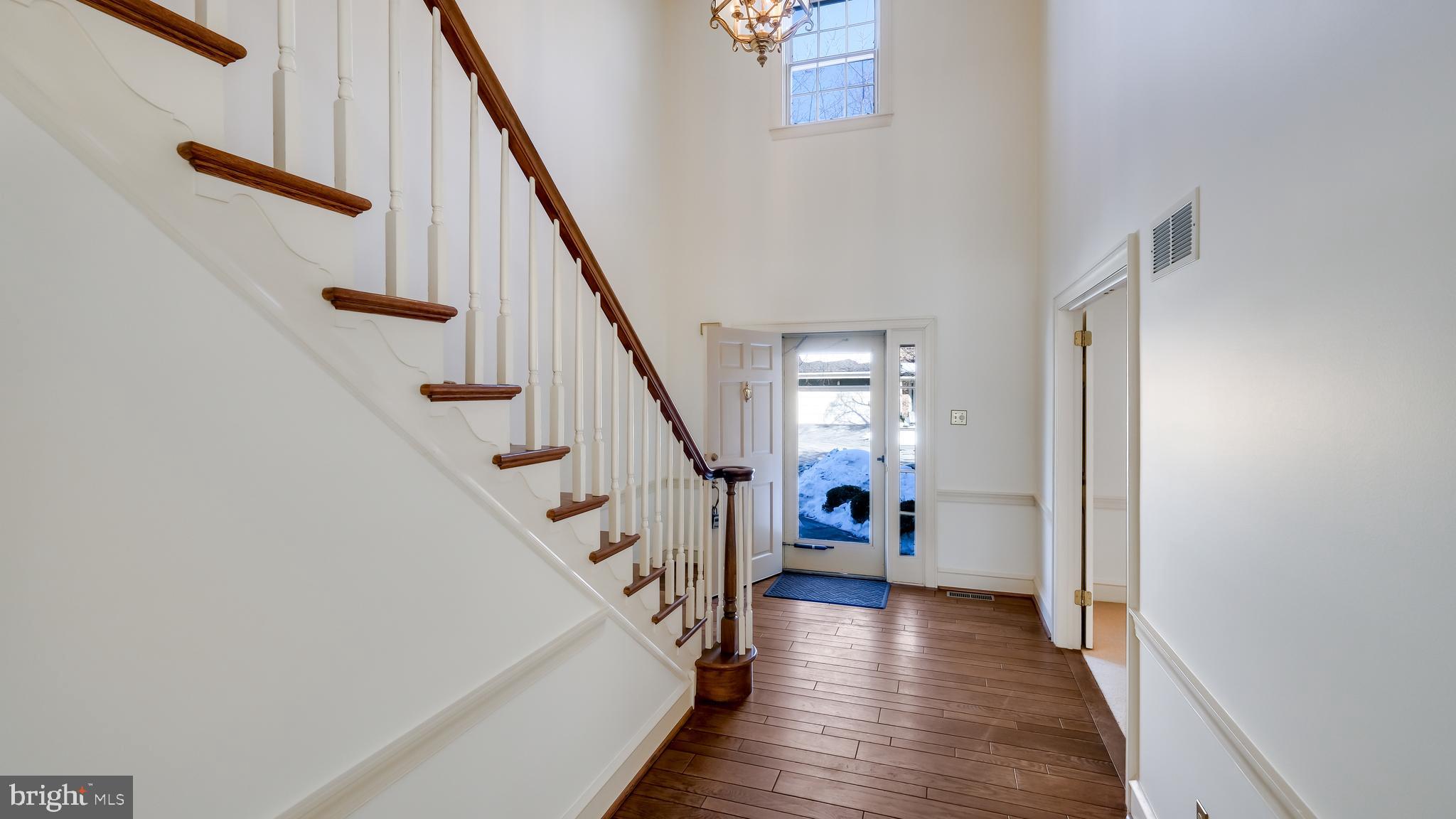45 Latham Court Doylestown, PA 18901 - Photo 4 of 41 a view of an entryway with wooden floor and stairs