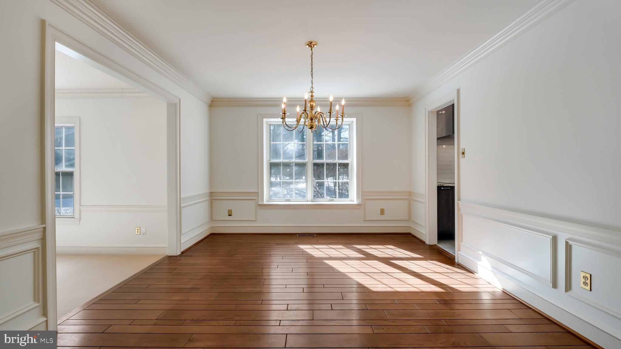 45 Latham Court Doylestown, PA 18901 - Photo 9 of 41 a view of an empty room with wooden floor and a window