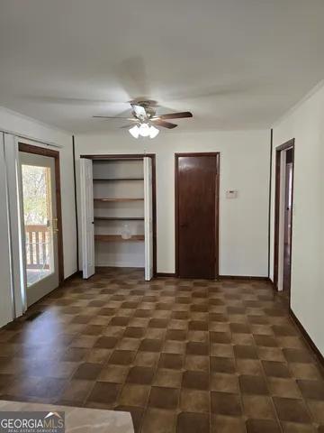 a view of an empty room with a window