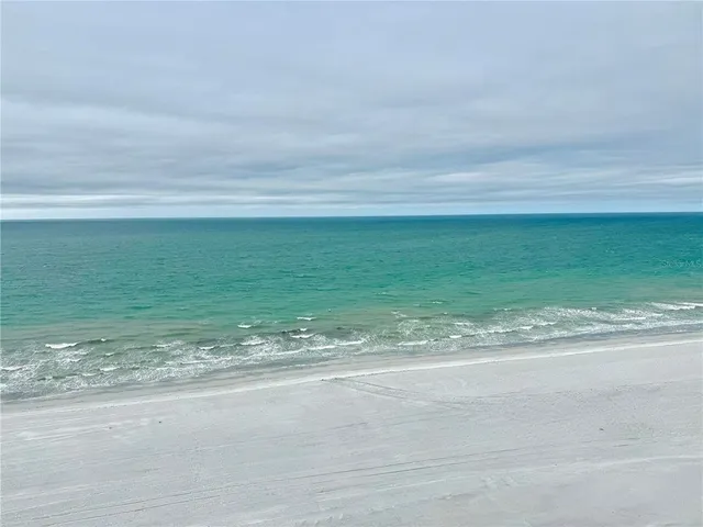 a view of a beach with an ocean view