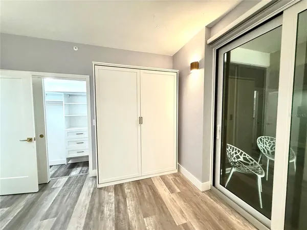 wooden floor with a bathroom