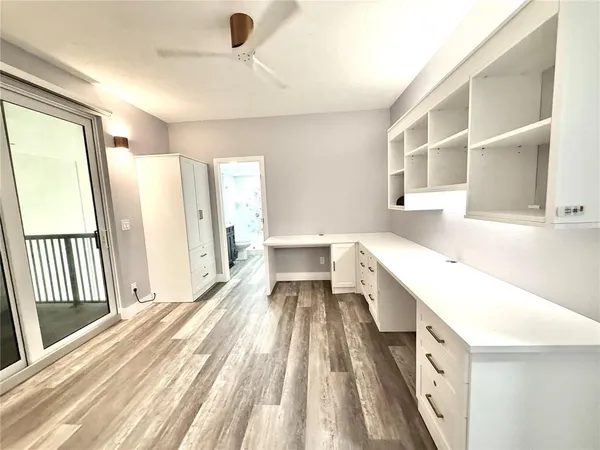 a spacious bathroom with a bathtub and a sink