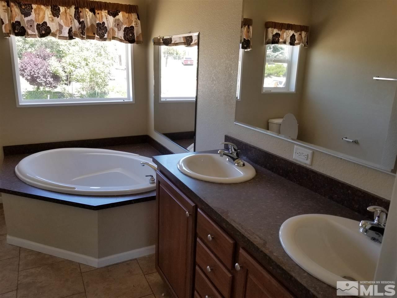 172 Hoge Road Reno, NV 89506 - Photo 13 of 17 a bathroom with a sink and a mirror