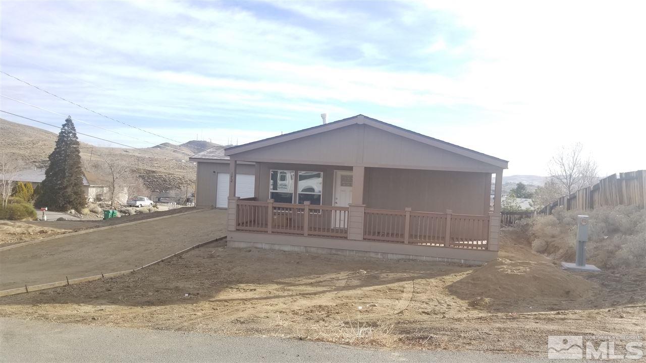 172 Hoge Road Reno, NV 89506 - Photo 2 of 17 a front view of a house with a yard and garage