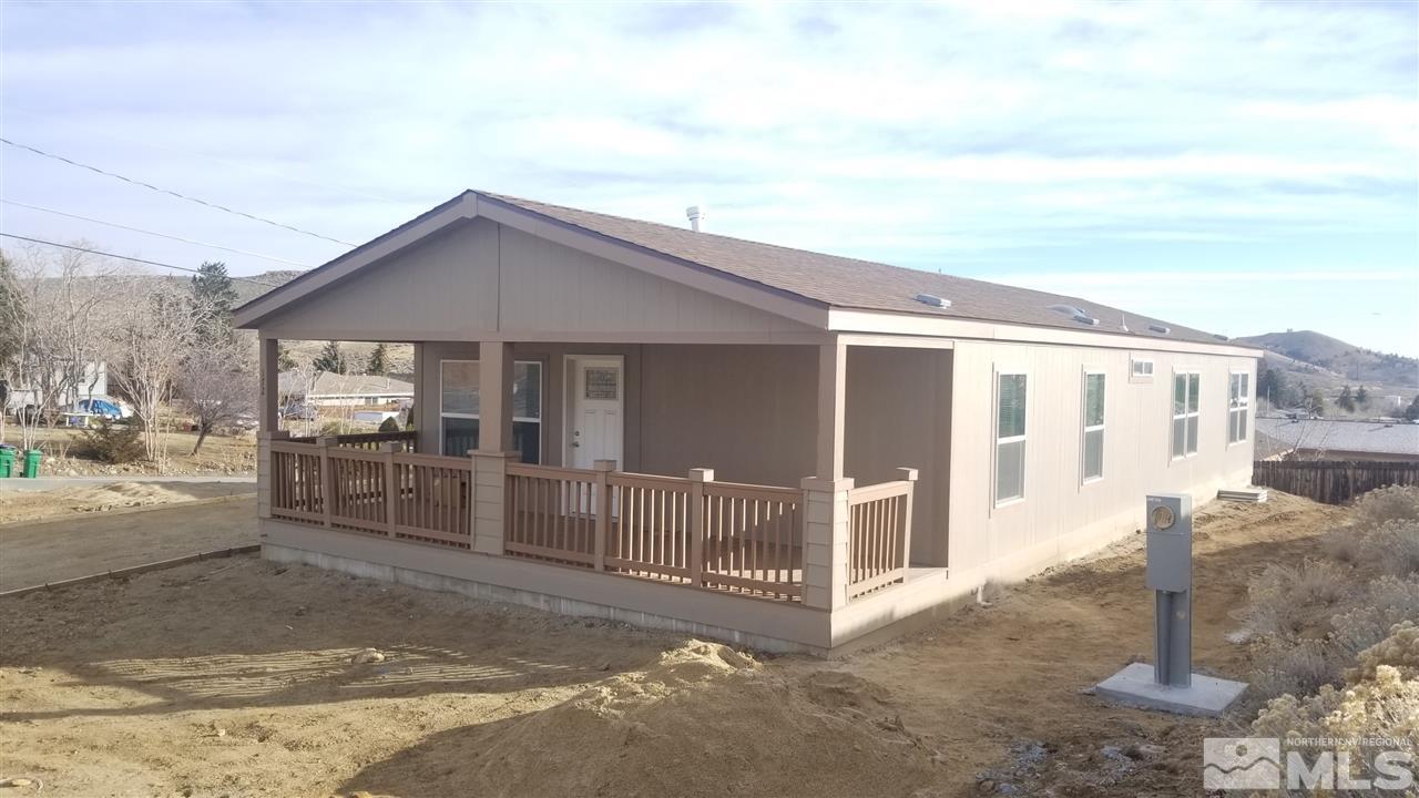 172 Hoge Road Reno, NV 89506 - Photo 5 of 17 a front view of a house with a yard and garage