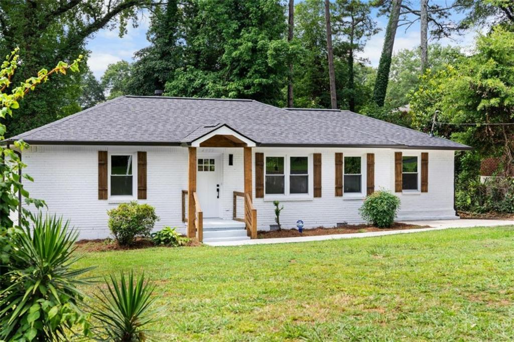 2479 Habersham Drive Decatur, GA 30032 - Photo 1 of 1 a front view of a house with yard and green space