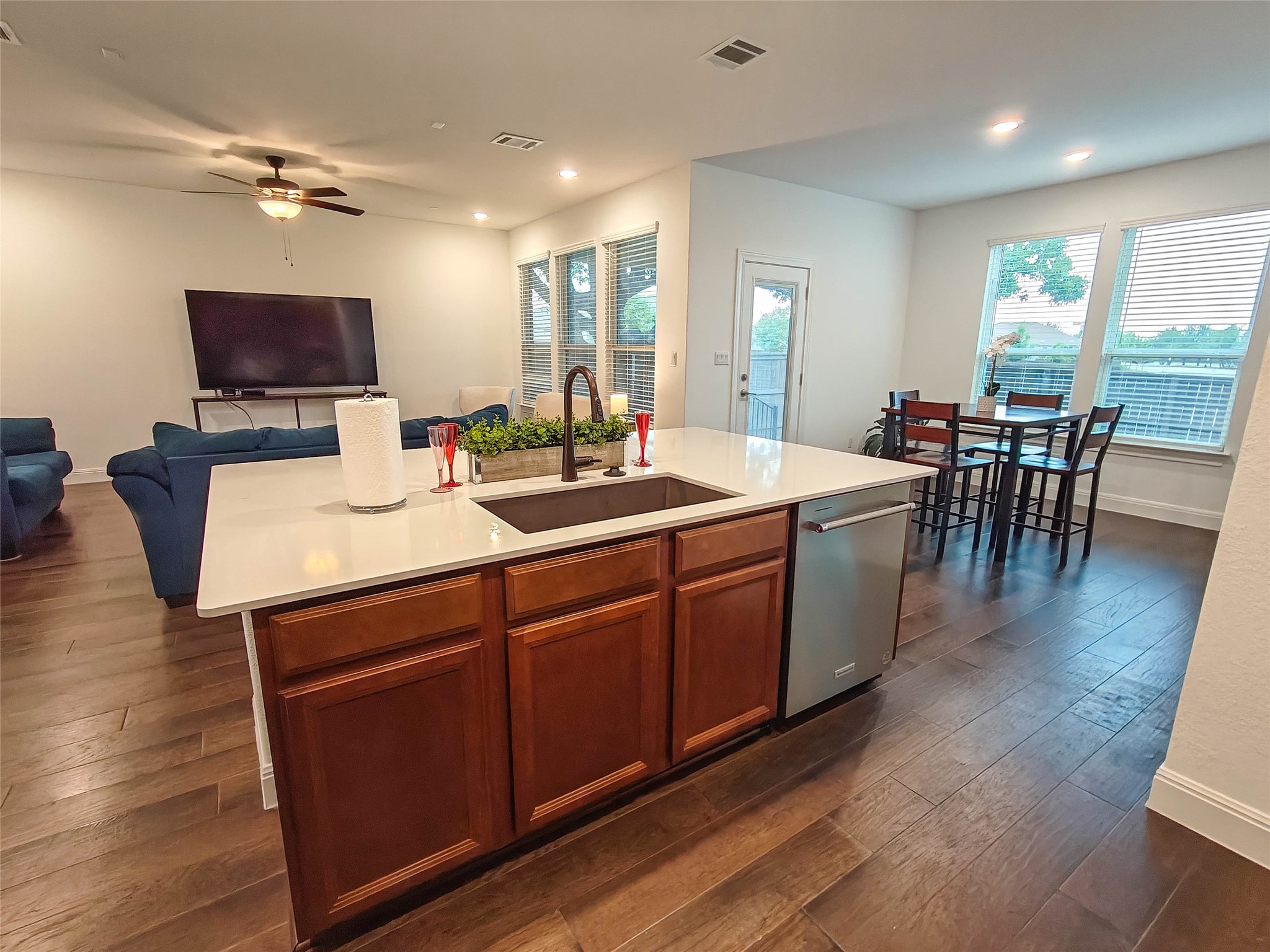 200 Fiddleneck Road Marble Falls, TX 78654 - Photo 7 of 37 a room with a table chairs flat screen tv and wooden floor