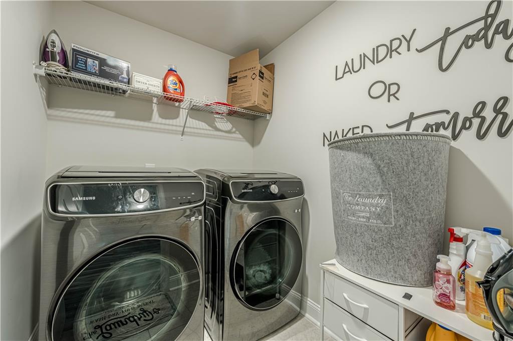 6940 Cedar Glen Road Atlanta, GA 30360 - Photo 12 of 24 a utility room with dryer and washer