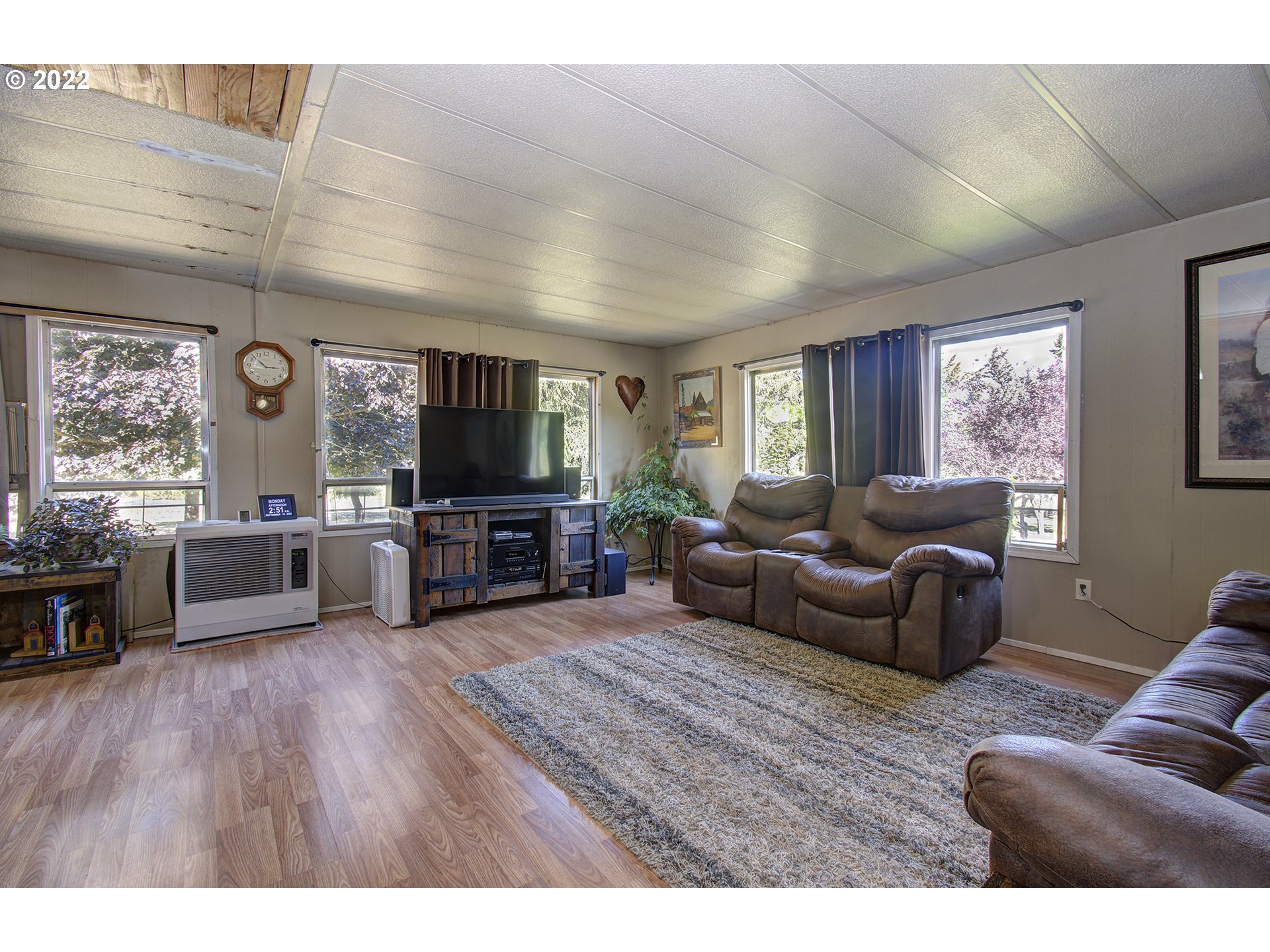 24402 Cox Road Rainier, OR 97048 - Photo 8 of 32 a living room with furniture and a flat screen tv