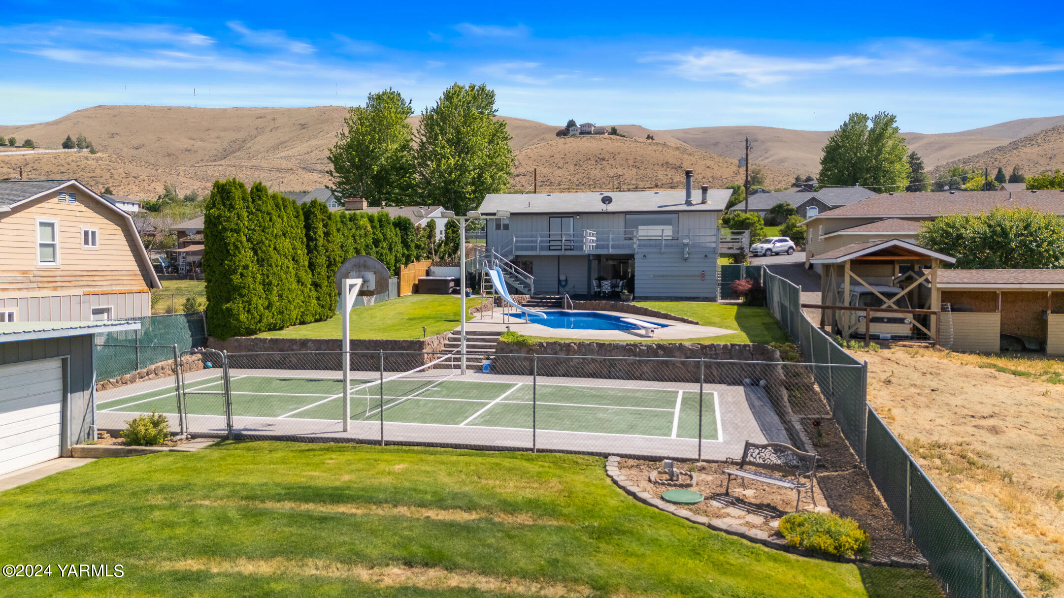 1005 Meadowbrook Road Yakima, WA 98903 - Photo 2 of 39 a view of a swimming pool with a patio