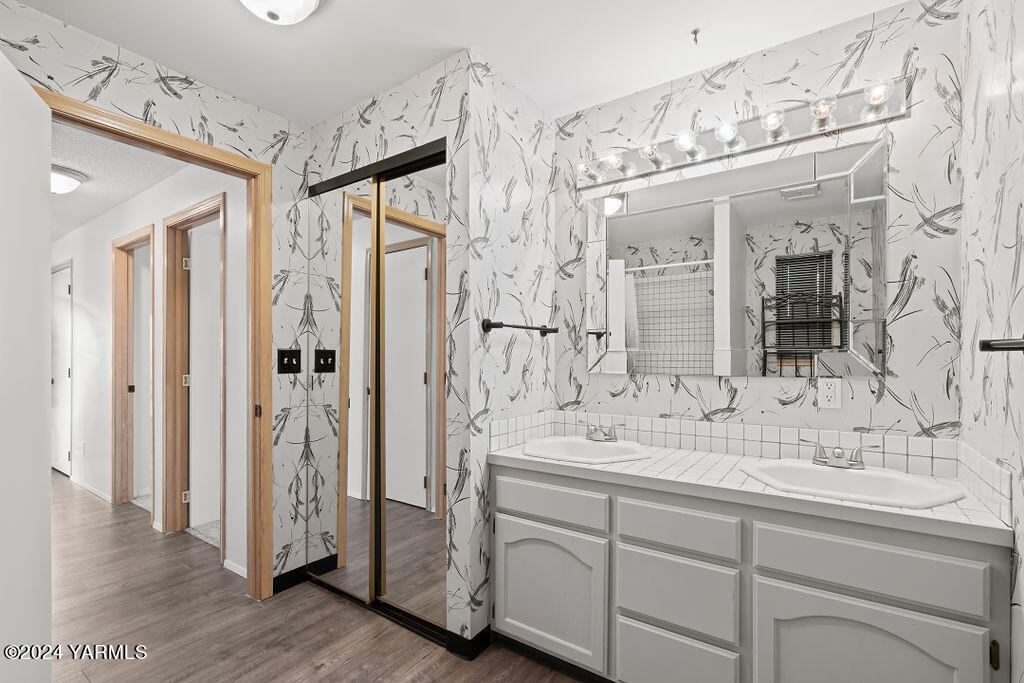 1005 Meadowbrook Road Yakima, WA 98903 - Photo 25 of 39 a bathroom with a double vanity sink mirror and shower
