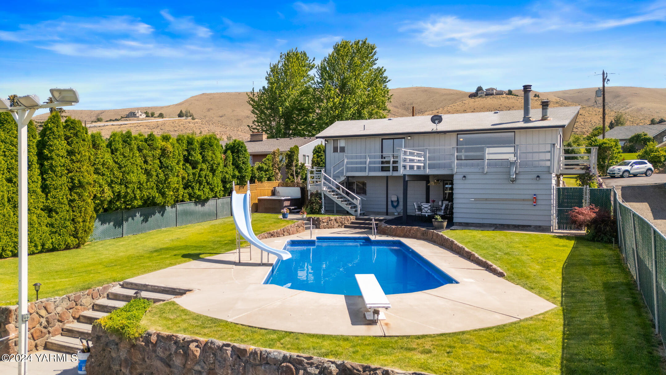 1005 Meadowbrook Road Yakima, WA 98903 - Photo 3 of 39 a view of a house with swimming pool