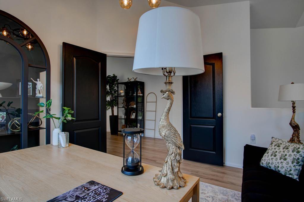 1969 Crestview Way, Unit 152 Naples, FL 34119 - Photo 19 of 35 a kitchen with a table and a refrigerator
