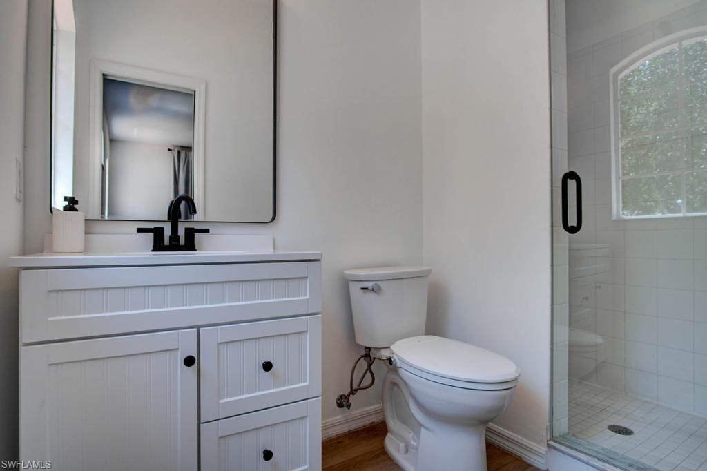 1969 Crestview Way, Unit 152 Naples, FL 34119 - Photo 23 of 35 a bathroom with a toilet sink and shower