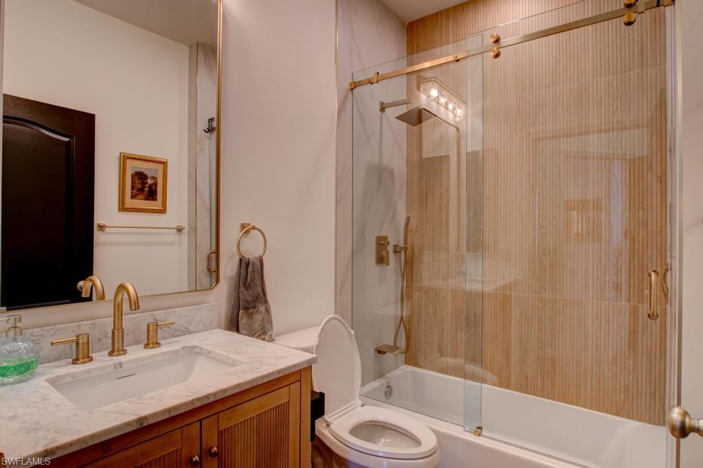 1969 Crestview Way, Unit 152 Naples, FL 34119 - Photo 27 of 35 a bathroom with a sink a toilet and shower