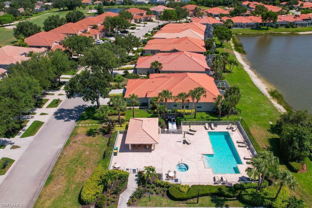 1969 Crestview Way, Unit 152 Naples, FL 34119 - Photo 34 of 35 an aerial view of house with yard swimming pool and outdoor seating