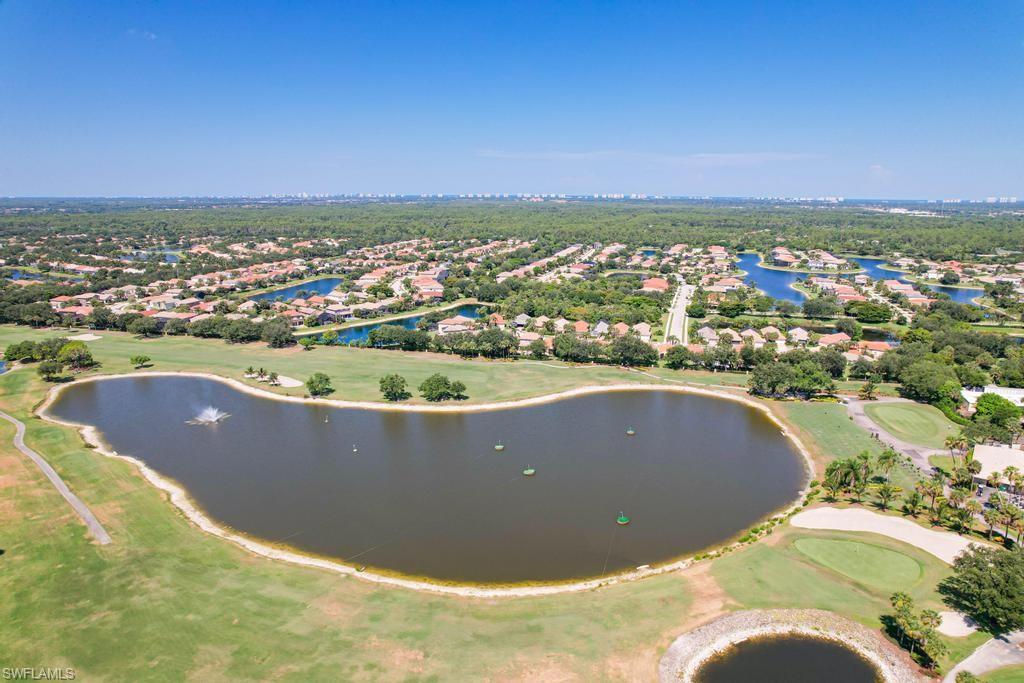 1969 Crestview Way, Unit 152 Naples, FL 34119 - Photo 35 of 35 an aerial view of a house with a swimming pool
