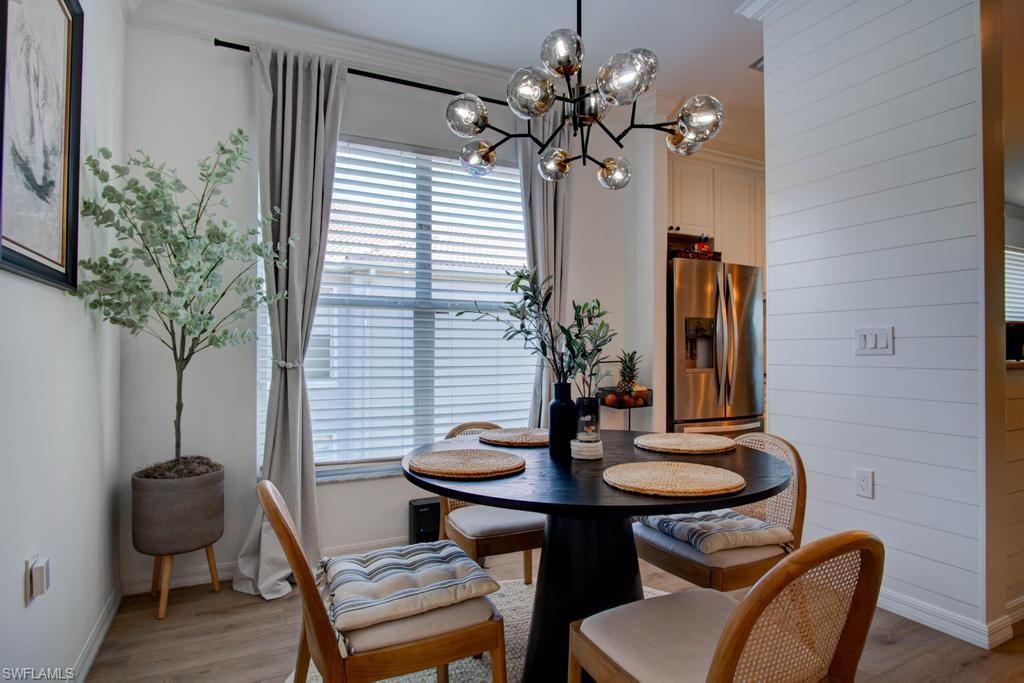 1969 Crestview Way, Unit 152 Naples, FL 34119 - Photo 9 of 35 a table and chairs in a room