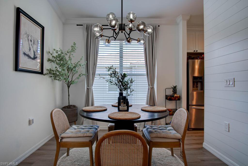1969 Crestview Way, Unit 152 Naples, FL 34119 - Photo 10 of 35 a dining room with furniture and window